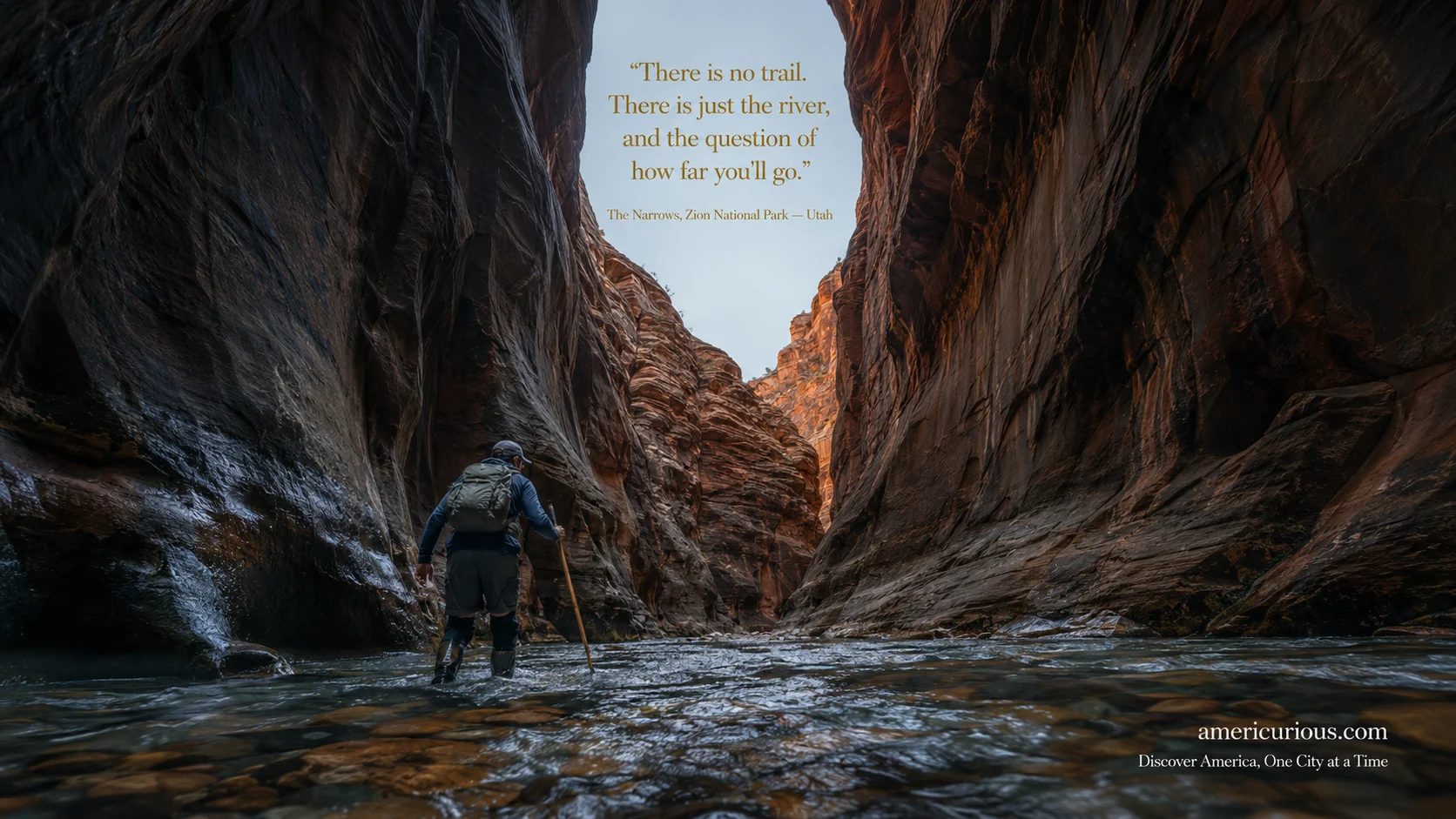 Hiker wading upstream through The Narrows slot canyon at Zion National Park, Utah, surrounded by towering Navajo sandstone walls — 2026 hiking guide via americurious.com.