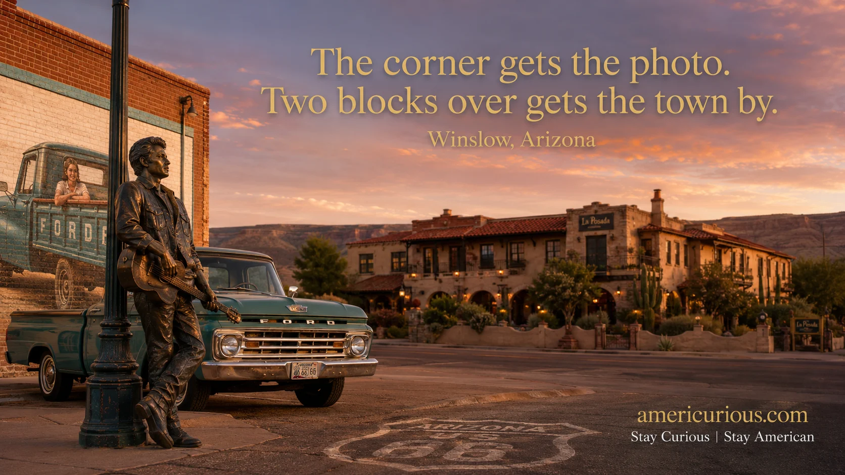 Bronze busker statue and flatbed-Ford mural at Standin' on the Corner Park in Winslow, Arizona, with La Posada Hotel visible down the block.