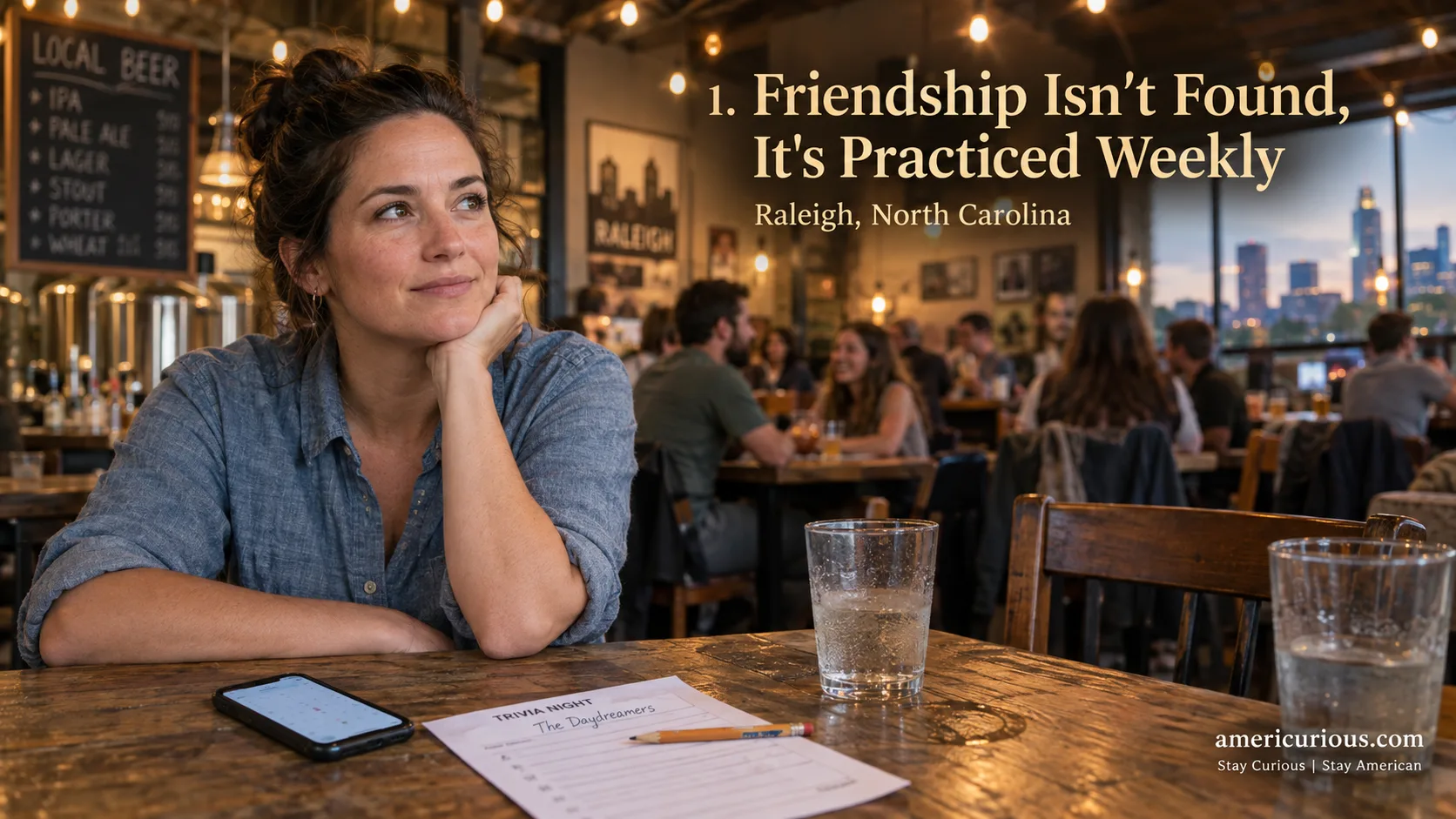 Adult alone at brewery trivia table in Raleigh with empty chairs, phone showing no plans, friendship recession americurious.com